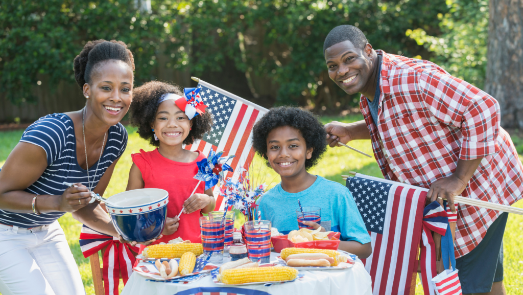 Family celebrating Independence Day with a barbecue.